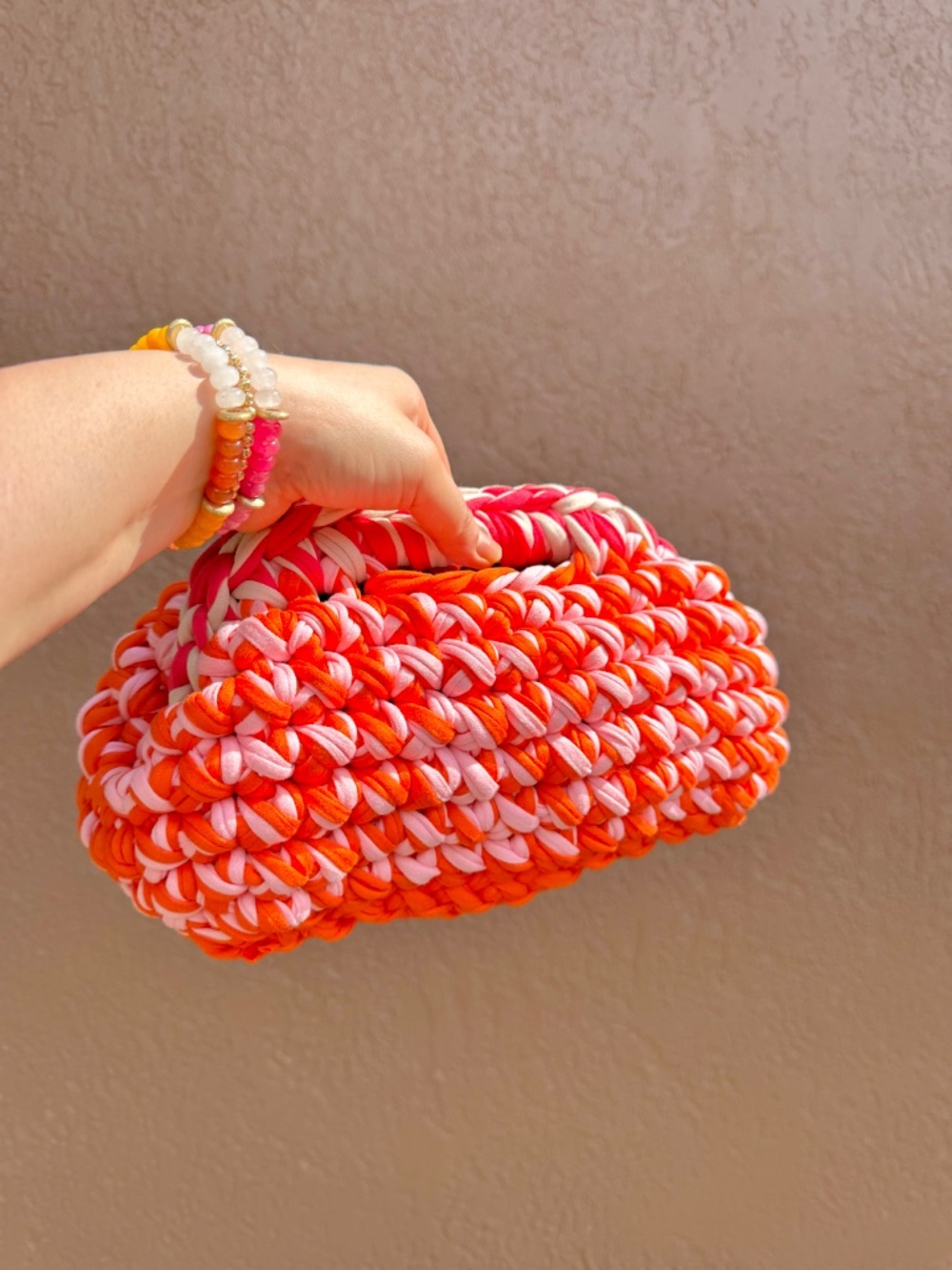 Pink & orange crochet clutch bag